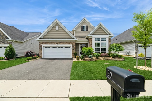 20 Metro Dr, Monroe, NJ 08831 - traditional-style house featuring asphalt driveway, a front lawn, stone siding, and a garage