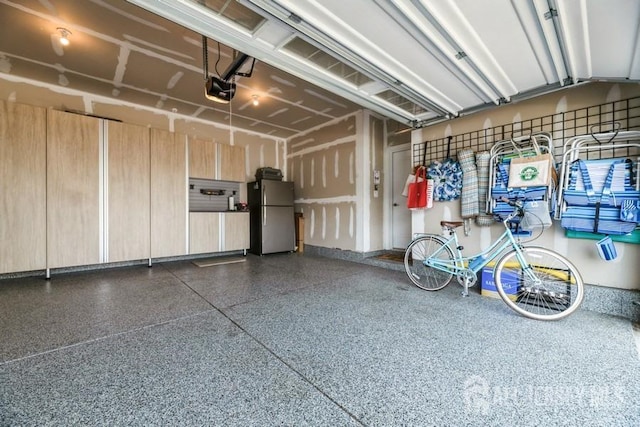 20 Metro Dr, Monroe, NJ 08831 - garage with freestanding refrigerator and a garage door opener