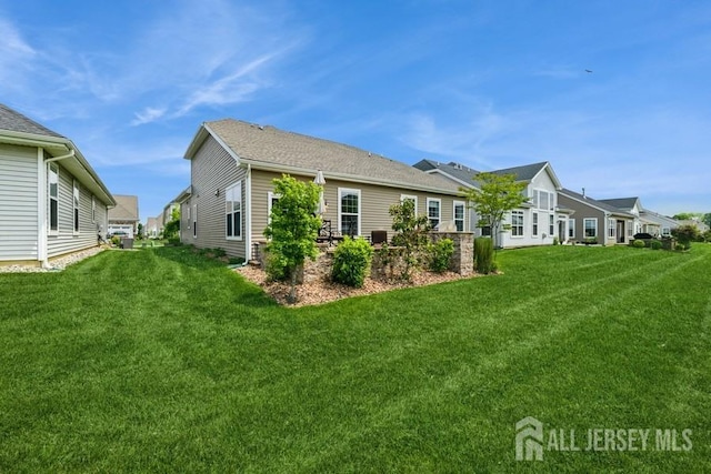 20 Metro Dr, Monroe, NJ 08831 - view of side of home with a yard and a residential view