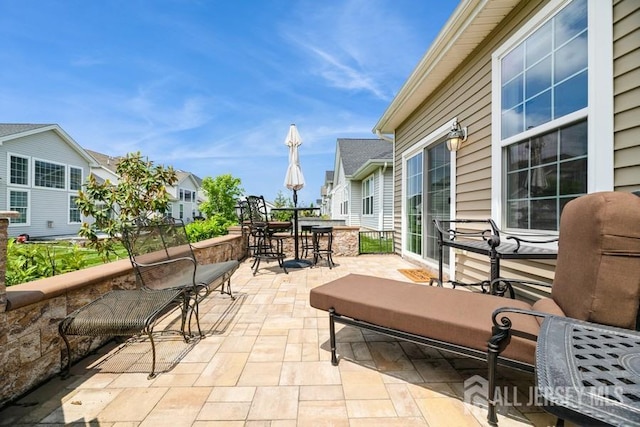 20 Metro Dr, Monroe, NJ 08831 - view of patio featuring outdoor dining area and a residential view