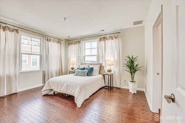 bedroom featuring dark hardwood / wood-style floors