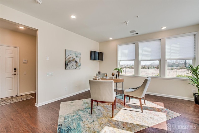 dining space featuring dark hardwood / wood-style flooring