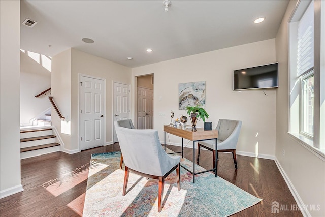 dining room with dark wood-type flooring