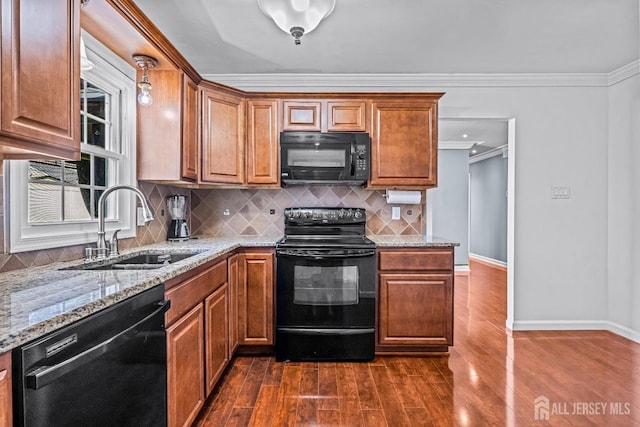 93 Ember Ln, Willingboro, NJ 08046 - kitchen featuring black appliances, a sink, dark wood-type flooring, light stone countertops, and crown molding