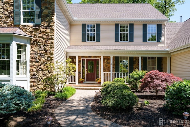 3 Wheatsheaf Ct, Plainsboro, NJ 08536 - doorway to property featuring stone siding, covered porch, and a shingled roof