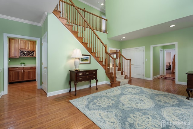 3 Wheatsheaf Ct, Plainsboro, NJ 08536 - staircase featuring crown molding, wood finished floors, and recessed lighting