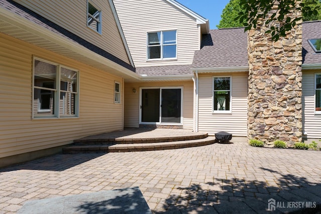 3 Wheatsheaf Ct, Plainsboro, NJ 08536 - doorway to property featuring roof with shingles and a patio
