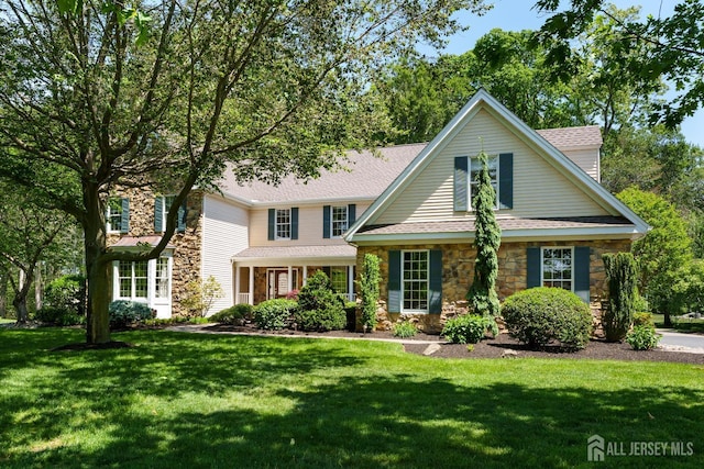 3 Wheatsheaf Ct, Plainsboro, NJ 08536 - traditional home featuring stone siding, a front lawn, and a shingled roof