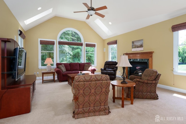 3 Wheatsheaf Ct, Plainsboro, NJ 08536 - living area with a skylight, light colored carpet, ceiling fan, a fireplace, and vaulted ceiling