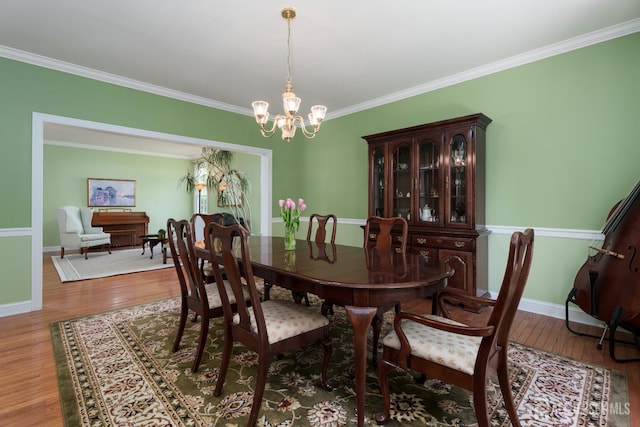 3 Wheatsheaf Ct, Plainsboro, NJ 08536 - dining space featuring a chandelier, wood finished floors, and ornamental molding