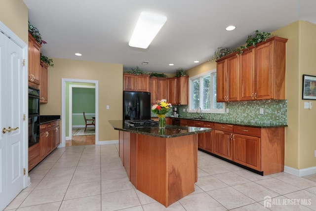 3 Wheatsheaf Ct, Plainsboro, NJ 08536 - kitchen with black appliances, decorative backsplash, light tile patterned floors, brown cabinets, and dark stone countertops