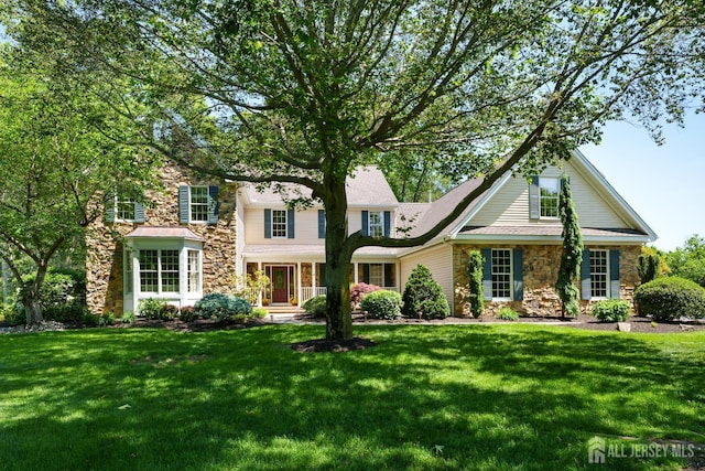 3 Wheatsheaf Ct, Plainsboro, NJ 08536 - traditional-style house with stone siding and a front yard