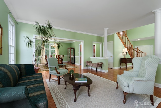 3 Wheatsheaf Ct, Plainsboro, NJ 08536 - living room featuring decorative columns, ornamental molding, wood finished floors, and stairs