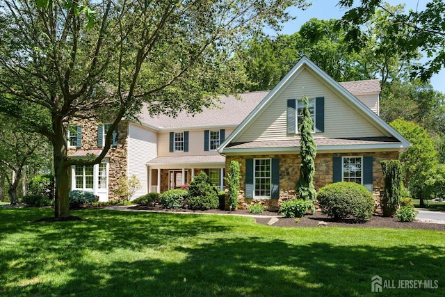 3 Wheatsheaf Ct, Plainsboro, NJ 08536 - traditional home featuring stone siding, a front yard, and a shingled roof