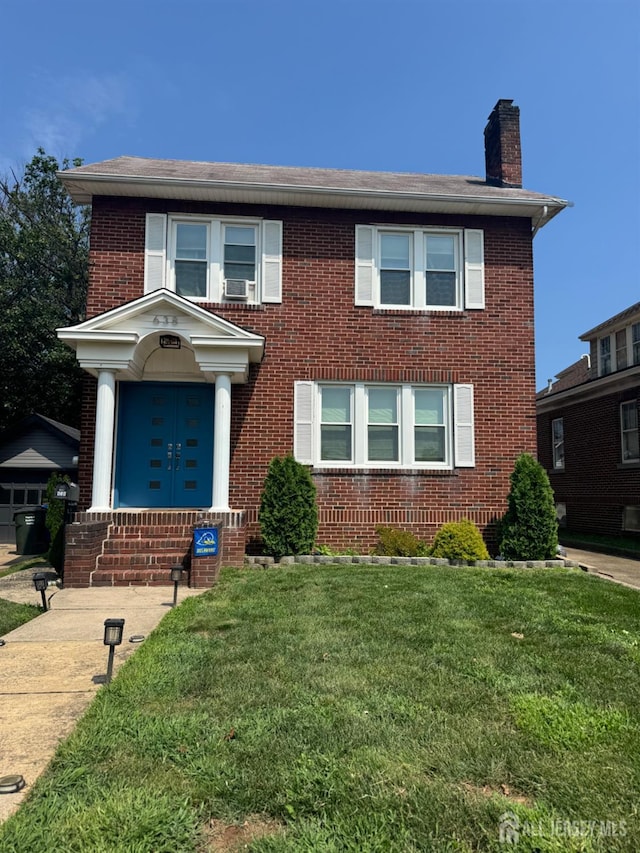 638 Linden Ave, Woodbridge Proper, NJ 07095 - view of front of home with brick siding, a chimney, and a front yard