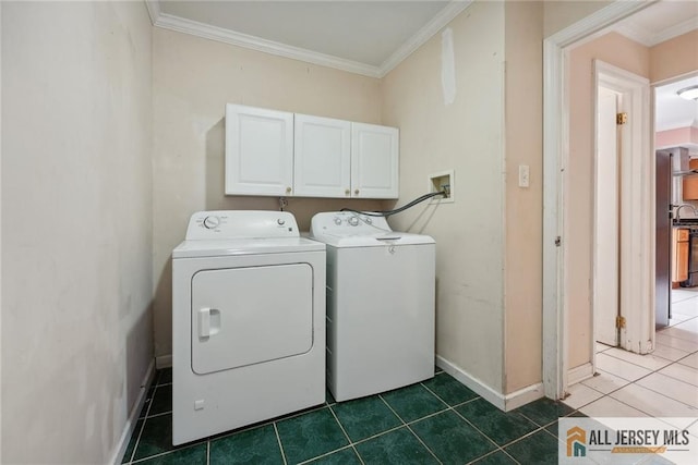 laundry room featuring sink, cabinets, dark tile patterned floors, independent washer and dryer, and ornamental molding