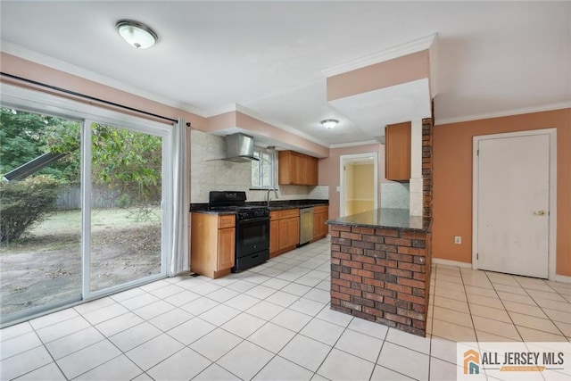 kitchen featuring light tile patterned floors, dark countertops, stainless steel dishwasher, black gas stove, and wall chimney exhaust hood