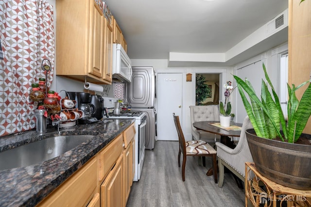 109 Washington St, Perth Amboy, NJ 08861 - kitchen with white appliances, wood finished floors, and dark stone counters