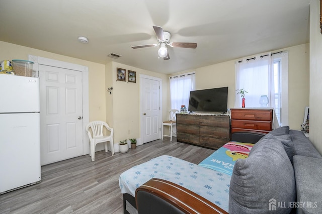 109 Washington St, Perth Amboy, NJ 08861 - living room featuring a ceiling fan, wood finished floors, and baseboards