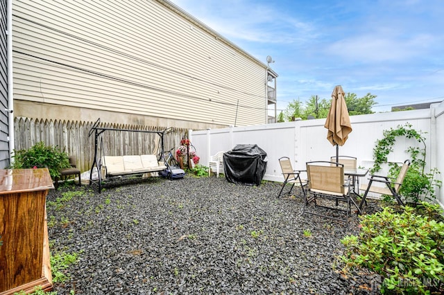109 Washington St, Perth Amboy, NJ 08861 - fenced backyard featuring a grill and outdoor dining space