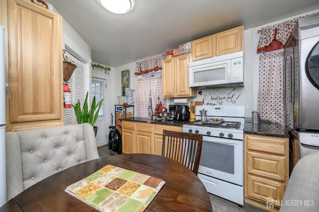 109 Washington St, Perth Amboy, NJ 08861 - kitchen featuring white appliances, stacked washer / dryer, and light brown cabinetry