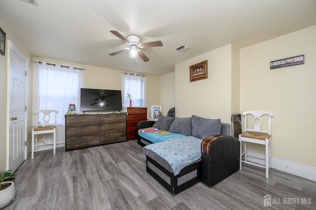 109 Washington St, Perth Amboy, NJ 08861 - living area with wood finished floors, a ceiling fan, and baseboards