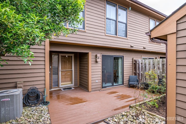 142 Maplewood Ct, Edison, NJ 08820 - back of house with central AC, a wooden deck, and fence