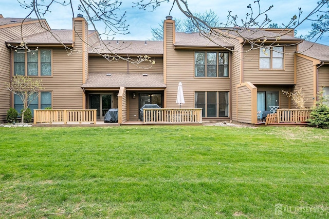142 Maplewood Ct, Edison, NJ 08820 - rear view of property featuring a wooden deck, a yard, a shingled roof, and a chimney