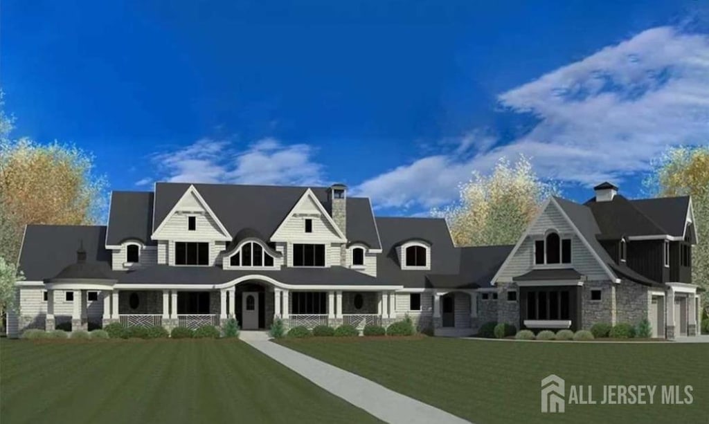 view of front facade featuring a front yard, stone siding, and a chimney