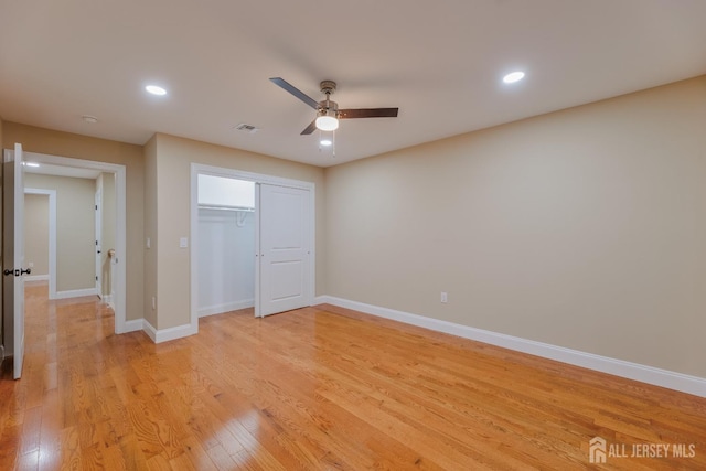 unfurnished bedroom with visible vents, baseboards, light wood-style flooring, a closet, and recessed lighting