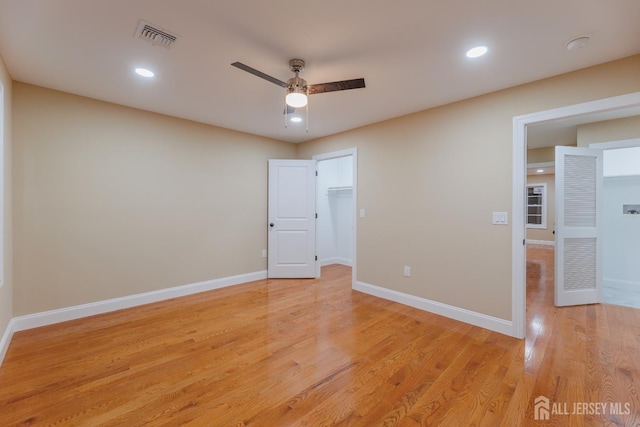 unfurnished bedroom featuring recessed lighting, light wood-type flooring, visible vents, and baseboards