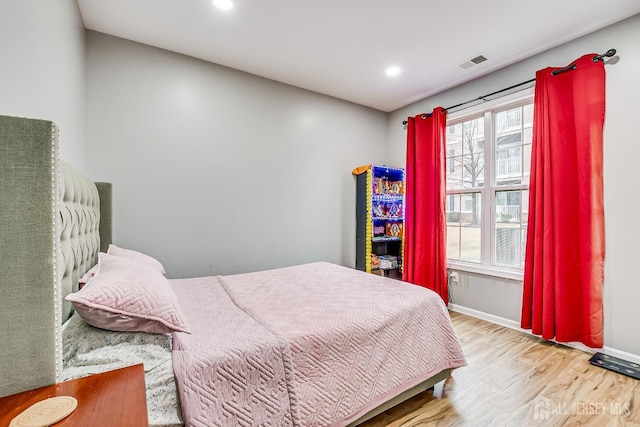 bedroom with light hardwood / wood-style floors