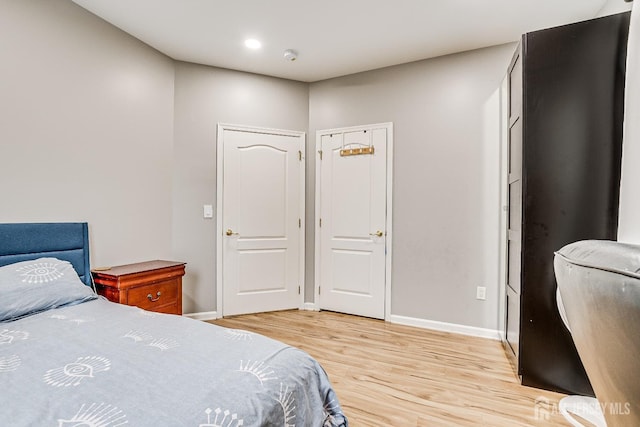 bedroom with light hardwood / wood-style floors