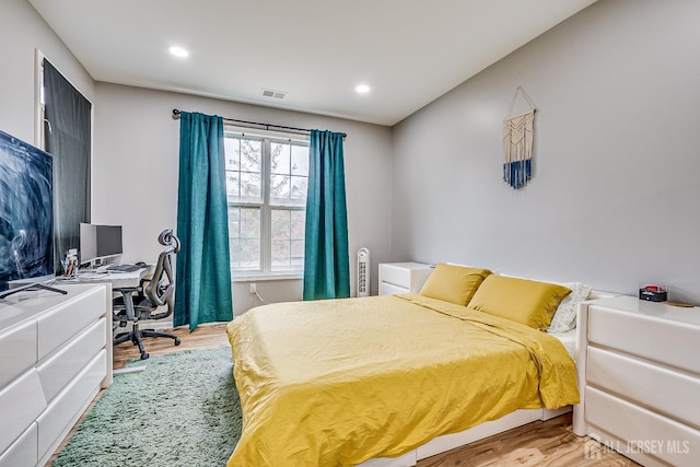 bedroom with wood-type flooring