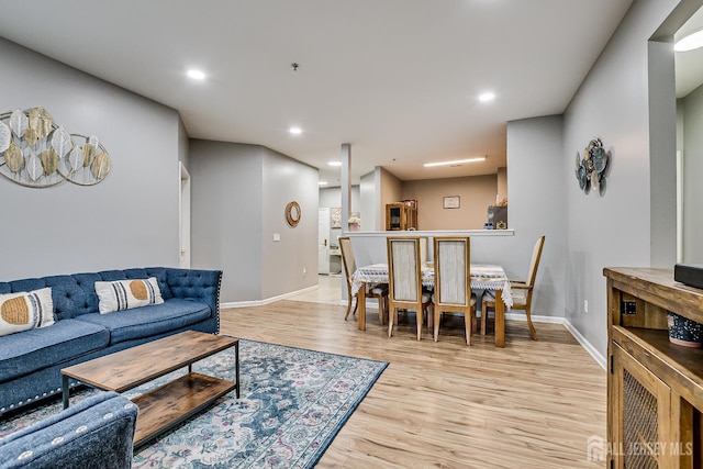 living room with light hardwood / wood-style floors