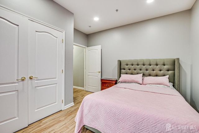 bedroom with light hardwood / wood-style floors