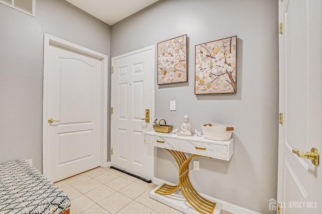 entryway featuring light tile patterned floors