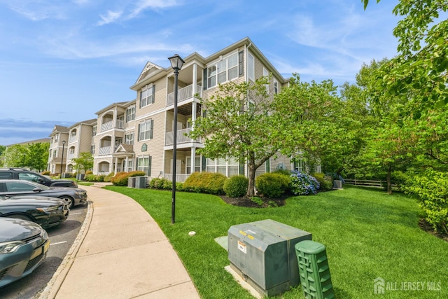 326 Sloan Ct, Matawan, NJ 07747 - view of apartment building / complex featuring uncovered parking