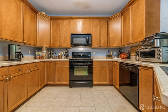 326 Sloan Ct, Matawan, NJ 07747 - kitchen featuring black appliances, light countertops, brown cabinetry, and light tile patterned flooring