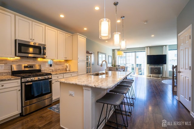 4 Woodrose Ln, Monroe, NJ 08831 - kitchen with tasteful backsplash, open floor plan, stainless steel appliances, and a sink
