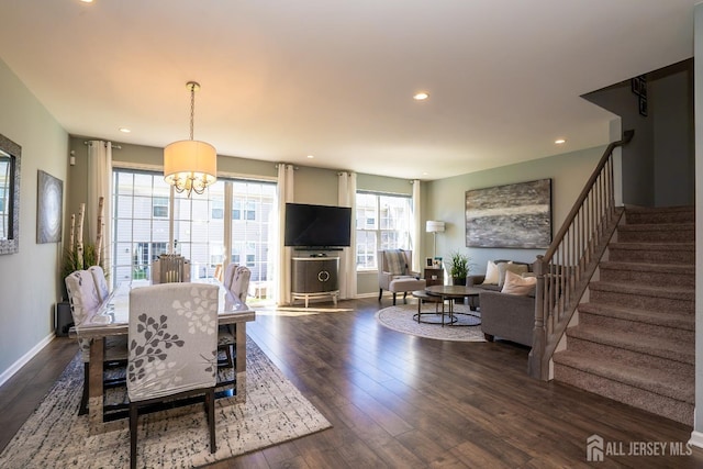 4 Woodrose Ln, Monroe, NJ 08831 - dining area featuring dark wood-type flooring, stairway, plenty of natural light, and an inviting chandelier
