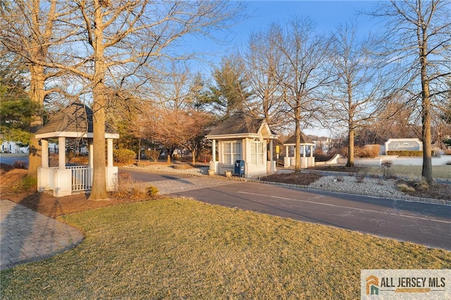 view of yard with aphalt driveway