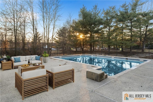 pool with fence, an outdoor living space, and a patio