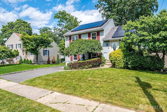6 Dundar Rd, Edison, NJ 08817 - view of front of home with solar panels and a front lawn