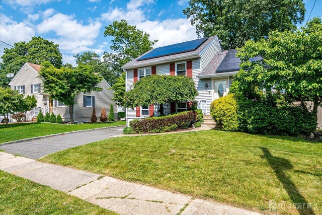 6 Dundar Rd, Edison, NJ 08817 - tri-level home featuring solar panels and a front yard