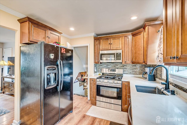 6 Dundar Rd, Edison, NJ 08817 - kitchen with stainless steel appliances, light countertops, light wood finished floors, crown molding, and tasteful backsplash
