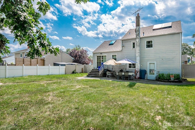 6 Dundar Rd, Edison, NJ 08817 - back of house with a chimney, a patio, and roof with shingles