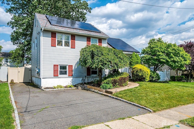 6 Dundar Rd, Edison, NJ 08817 - view of front of home with solar panels, a gate, and asphalt driveway