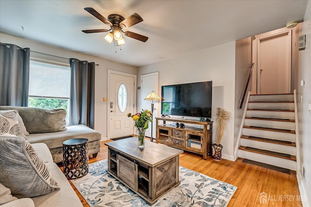 6 Dundar Rd, Edison, NJ 08817 - living room featuring a ceiling fan, stairway, and light wood-style floors