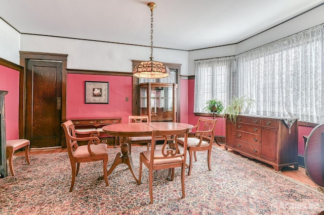 dining area with light wood finished floors